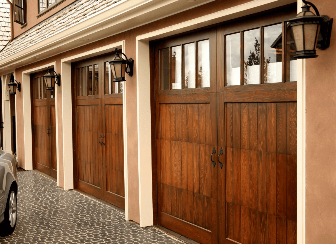 A row of garage doors in front of a building.