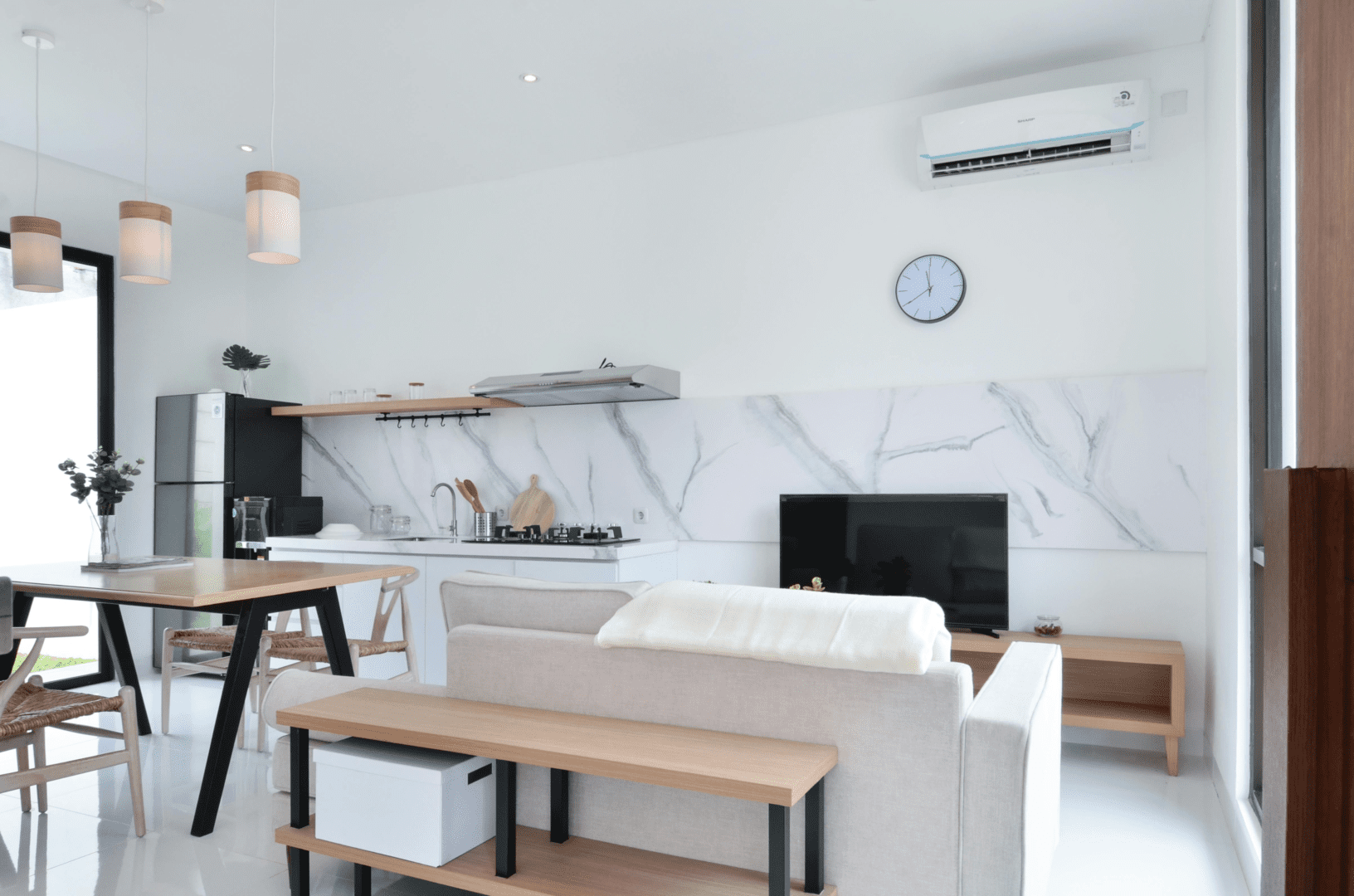 A living room with white walls and furniture.